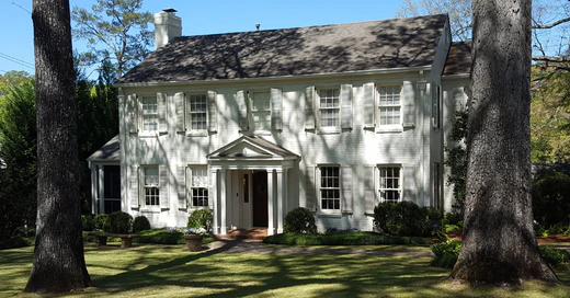 white house with light blue exterior shutters