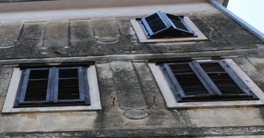 exterior shutters on historical stone home
