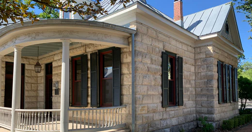 green louvered exterior shutters on home